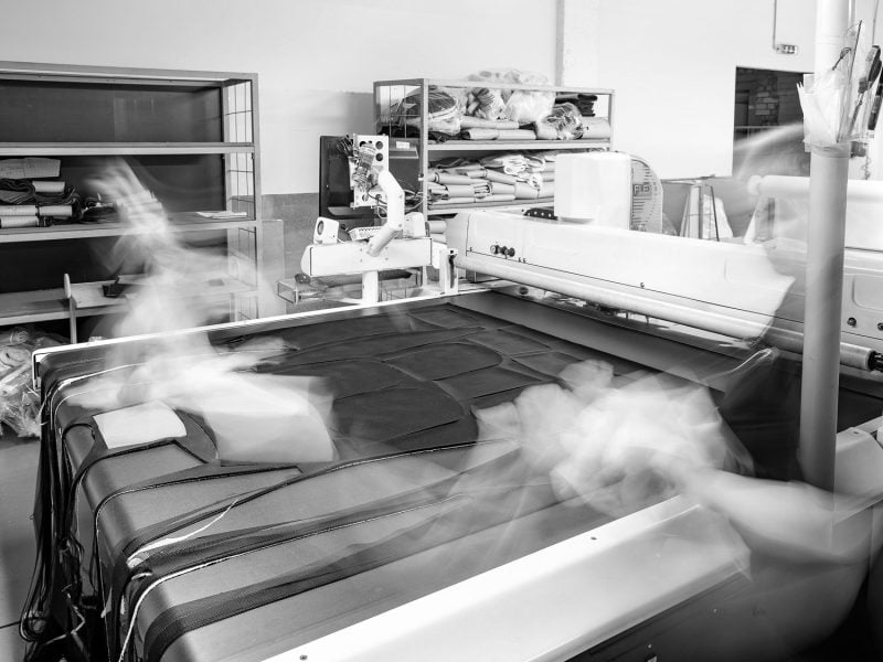 Fabric being cut on the automatic cutting table